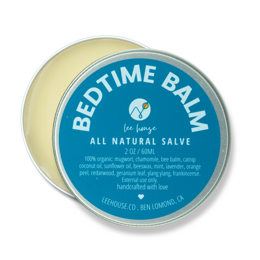 Tin of Bedtime Balm with blue label on a white background