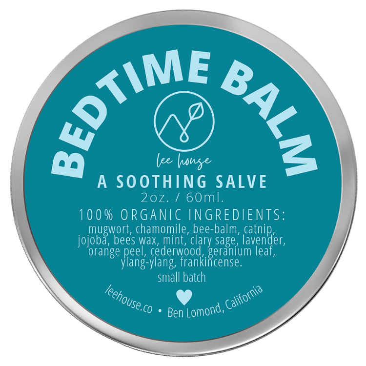 photograph of Bedtme Balm - photo contains a tin of slave with a bright blue label that reads: Bedtime Balm - all natural soothing salve. 100% organic: mugwort, chamomile, bee balm, catnip, jojoba, clary sage, mint, lavendar, orage peel, cedarwood, geranium leaf, ylnag ylang, frankincense, external use only. handcrafted with love. leehouse.co