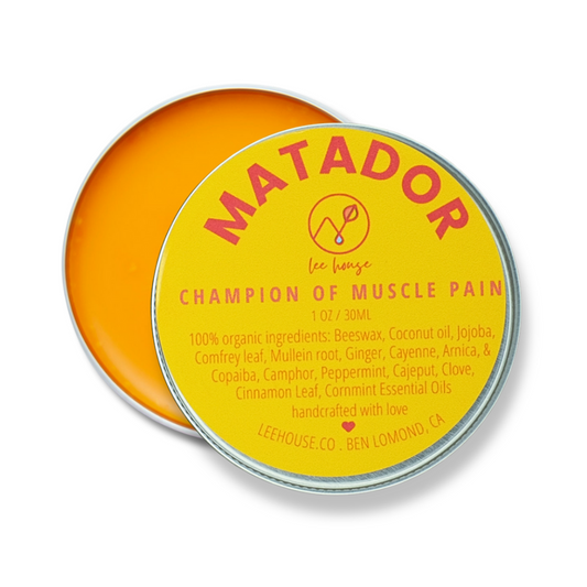 Matador balm tin with yellow label on a white background
