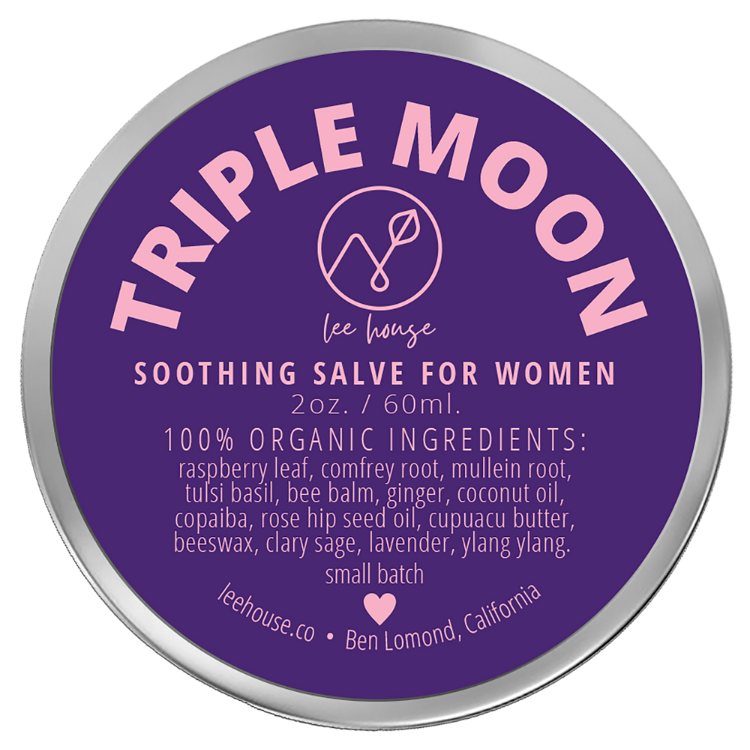 photo of a 2 oz tin of triple moon soothing balm for women depciting a purple and pin label that reads: 100% organic ingredients: raspberry Leaf, comfrey root, mullein root, tulsi basil, bee balm, ginger, coconut oil, copaiba, rose hip seed oil, cupuacu butter, beeswax, clary sage, lavender, ylang ylang. External Use Only. handcrafted with love, leehouse.co